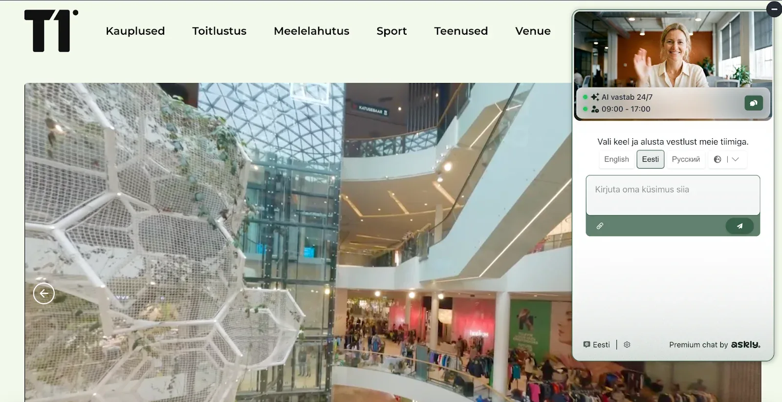 T1 Tallinn website showing the mall’s atrium, with the Askly chat window open and a choice of languages
